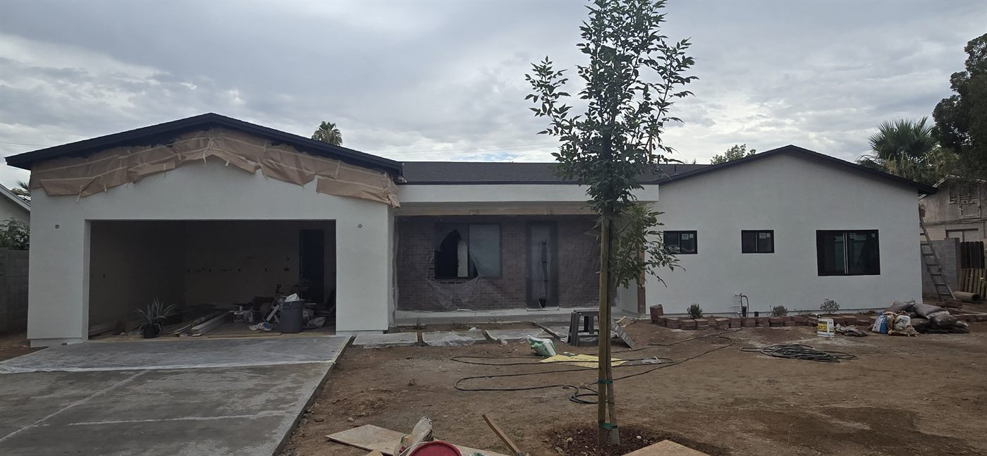 Exterior paint and brick entry taking shape