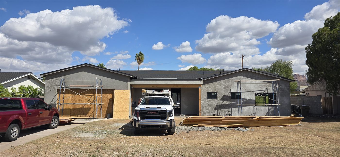 Stucco and new roof on the expanded structure